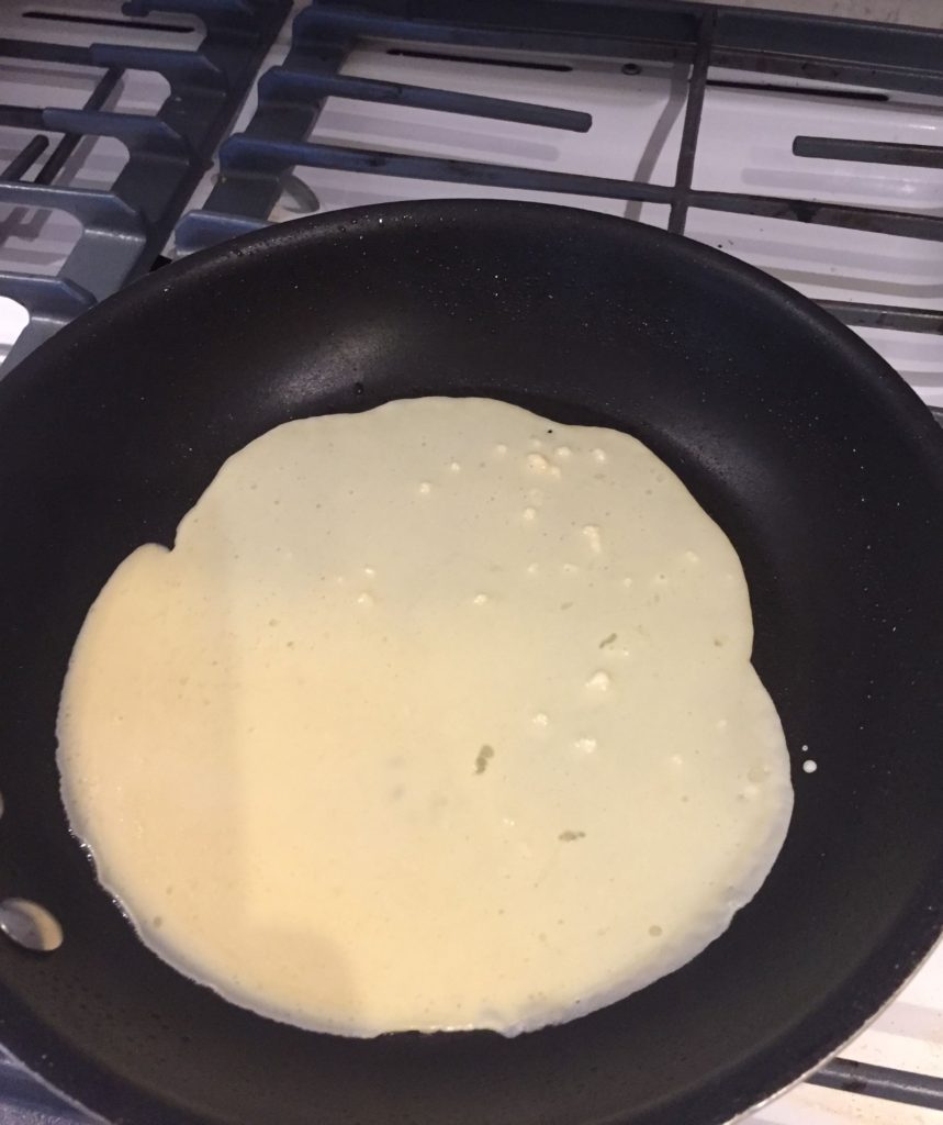 Spread the pancake mixture over the pan