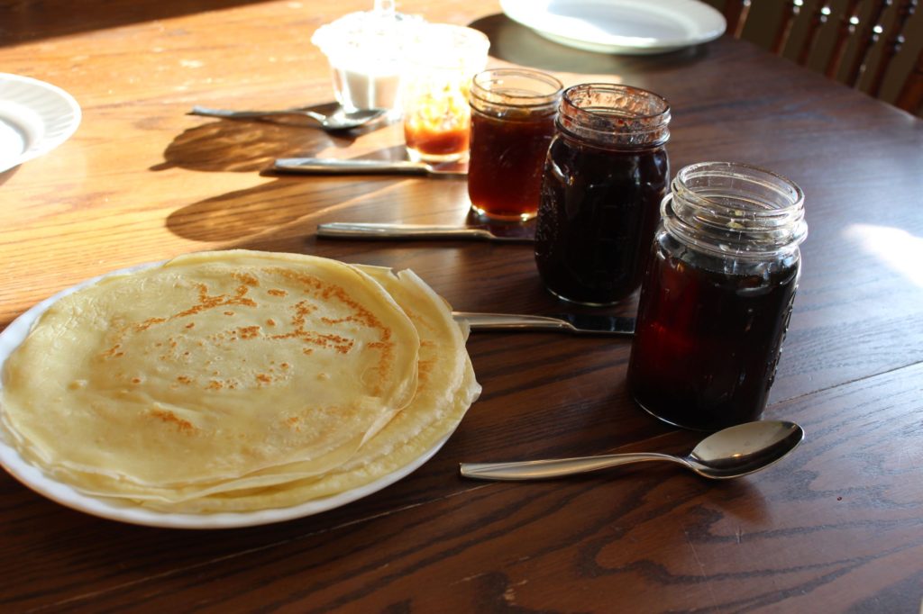 Swedish Pancakes with toppings. Jams, syrup, and sugar