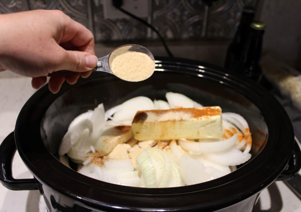 Add the Onions, Garlic, Butter, Sauerkraut, and seasonings to the Crock Pot 
