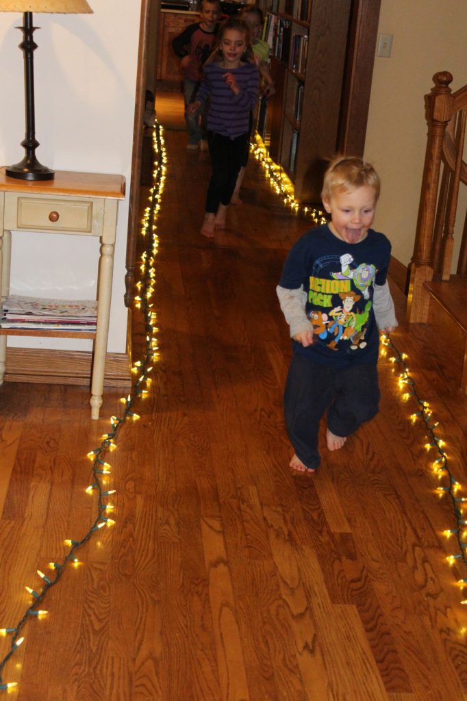 Kids racing in christmas lights being tested