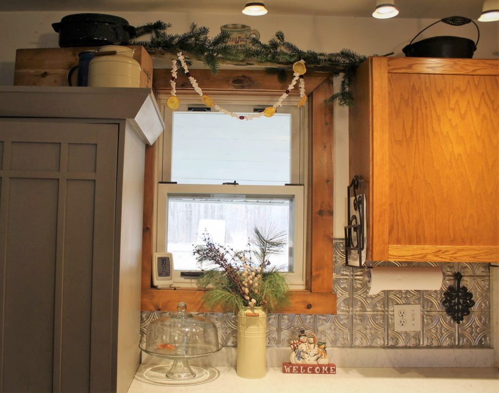kitchen decorated with pine bows and popcorn garland