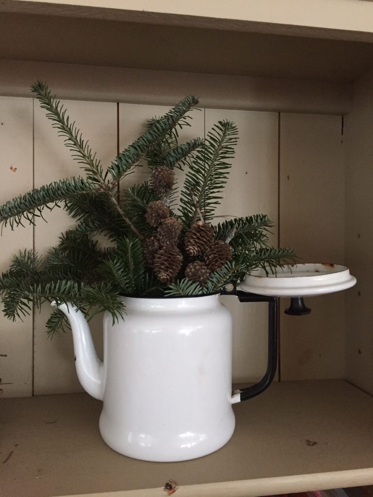 antigue teapot decorated for christmas/winter