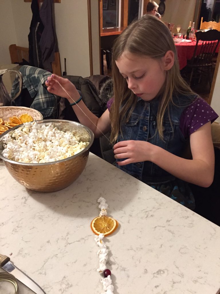 stringing up the popcorn garland