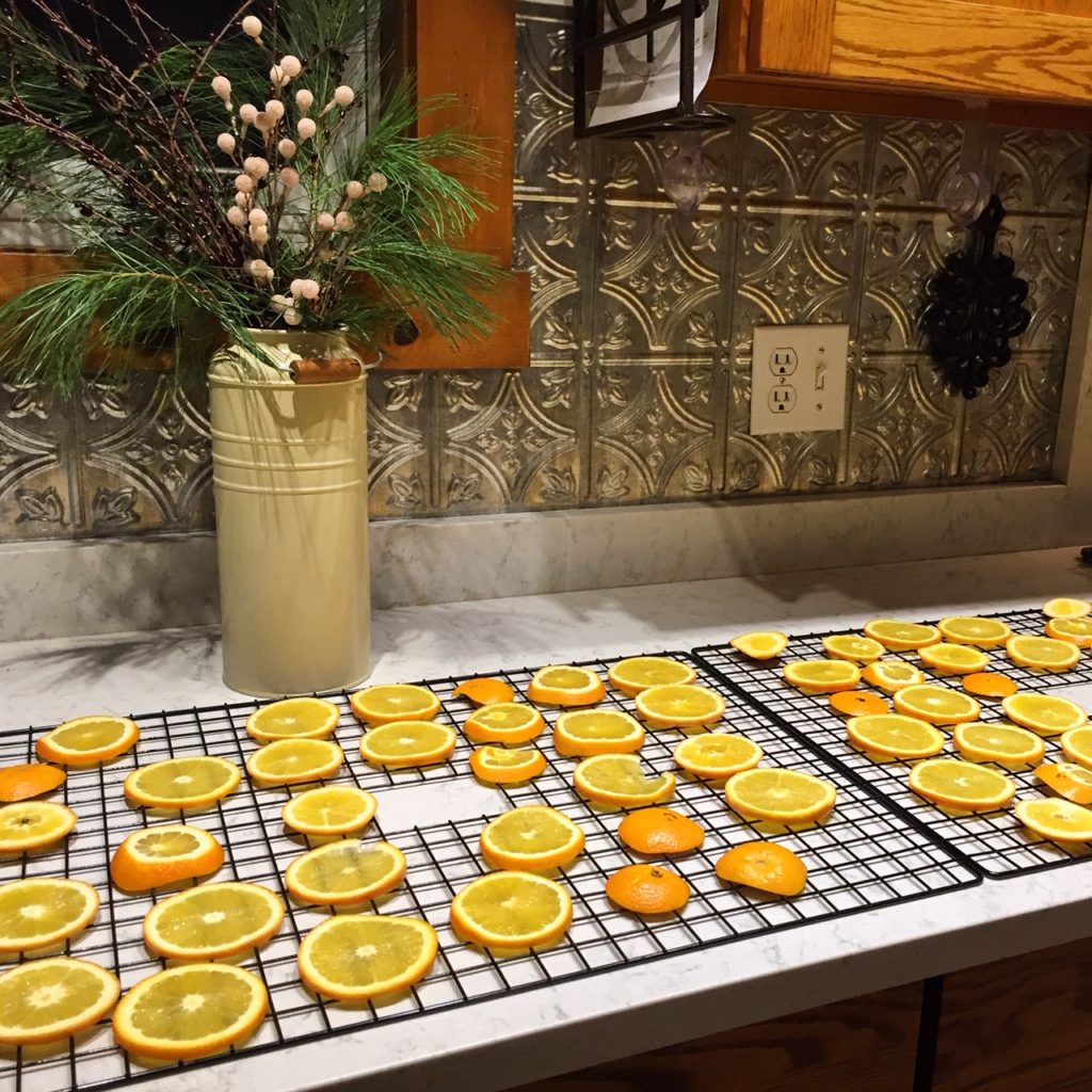 place cut orange slices onto dehydrator trays