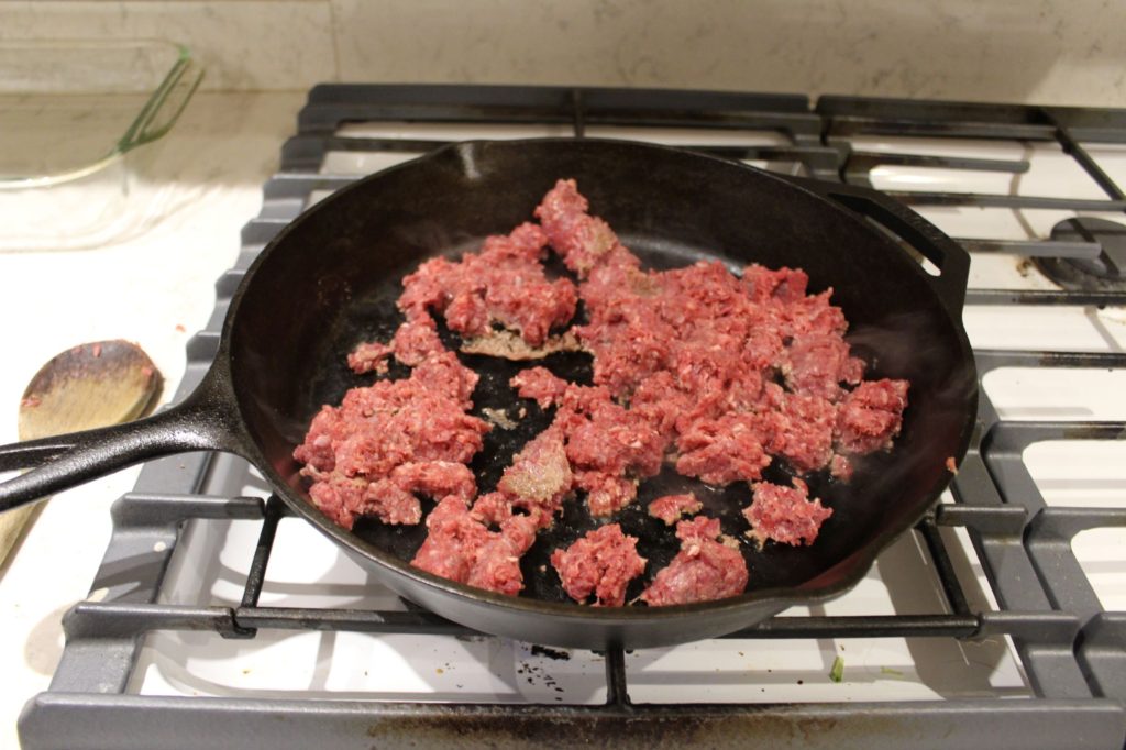 Browning ground beef on cast iron
